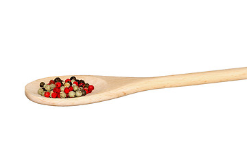 Image showing Mixed pepper on a light wooden spoon