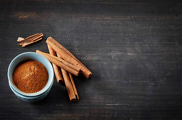 Image showing Cinnamon sticks and powder