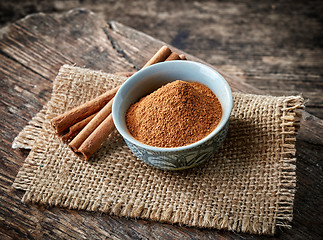 Image showing Cinnamon sticks and powder