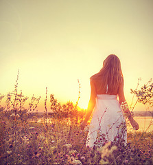 Image showing lady walking through the meadow