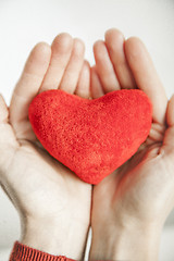 Image showing love concept. holding a red heart in hands.