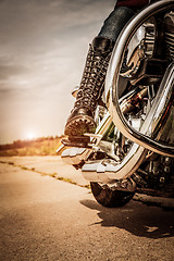 Image showing Biker girl riding on a motorcycle