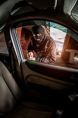 Image showing Car thief in a mask.