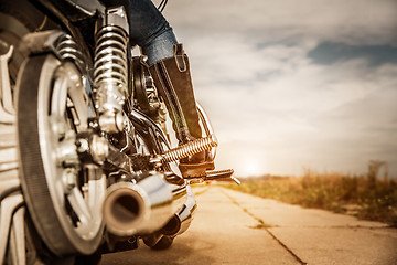 Image showing Biker girl riding on a motorcycle