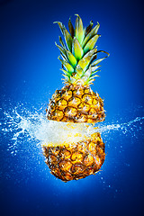 Image showing Pineapple splashed with water