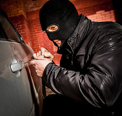 Image showing Car thief in a mask.