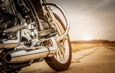 Image showing Biker girl riding on a motorcycle