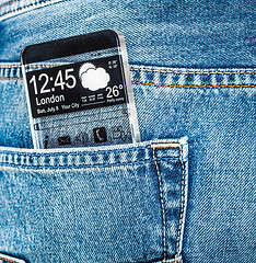 Image showing Smartphone with a transparent screen in a pocket of jeans.