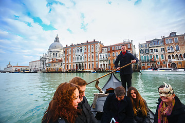 Image showing Gondola with tourists in Venice