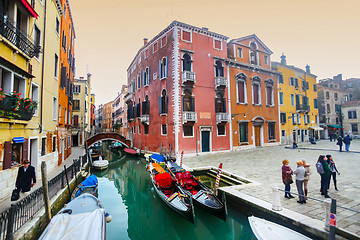 Image showing Gondolas moored along water canal in Venice