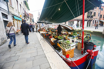 Image showing Boat with fruit and vegetable in water canal