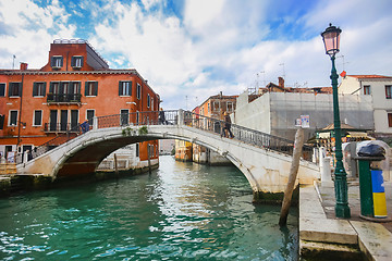 Image showing Tourists walking on bridge in Venice