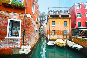 Image showing Boats parked next to buildings 