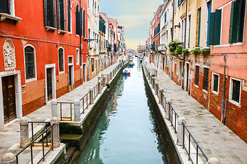 Image showing Boats moored along water canal