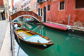 Image showing Gondolas parked in water canal