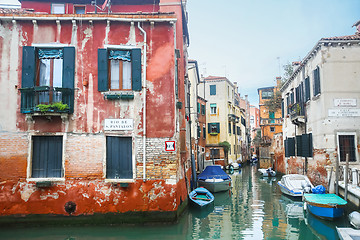 Image showing Boats parked in italian water canal