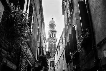 Image showing Church tower in old part of city bw