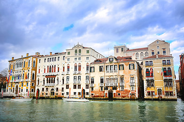 Image showing Boats sailing next to buildings