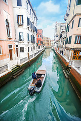 Image showing Boat sailing in italian water channel