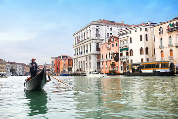 Image showing Gondola sailing in italian water canal