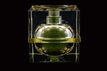 Image showing Bottle of perfume over black background