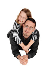 Image showing Daughter piggyback on dad.