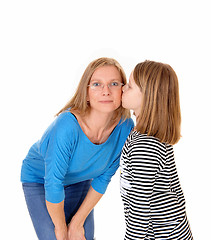 Image showing Girl kissing her mom.