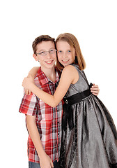 Image showing Brother and sister hugging.