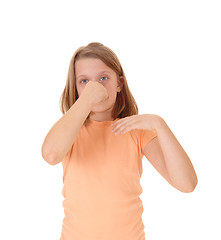 Image showing Girl holding her nose.