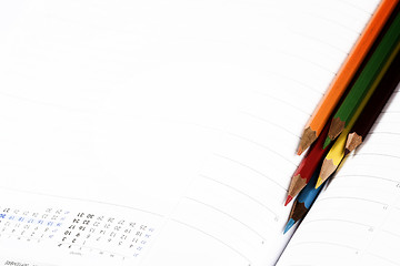 Image showing Color pencil and agenda