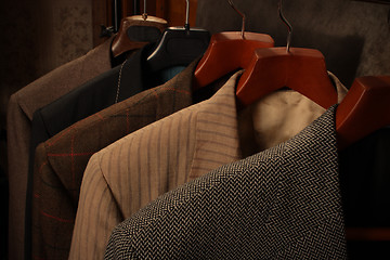 Image showing several coats on hangers