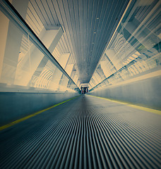 Image showing moving blue escalator