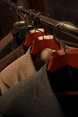 Image showing several coats on hangers