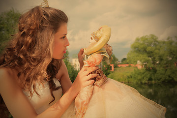 Image showing princess plays with loved doll