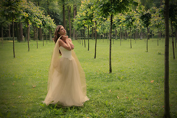 Image showing girl peers into sky