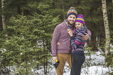 Image showing Young pair searching a christmas tree