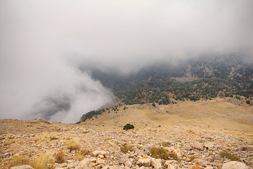 Image showing mountains peaks clouds ran over  tops