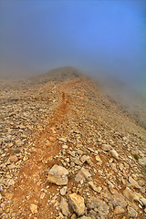 Image showing very beautiful mountain trail in fog