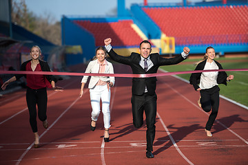 Image showing business people running on racing track