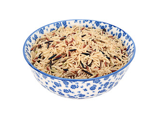 Image showing Mixed rice grains in a blue and white china bowl