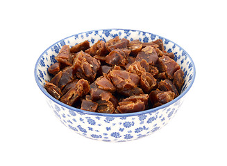 Image showing Chopped dates in a blue and white china bowl