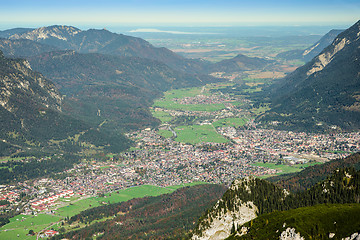 Image showing Green valley with small town in Alps mountains 