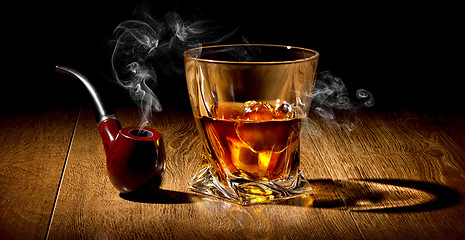 Image showing Pipe and whiskey