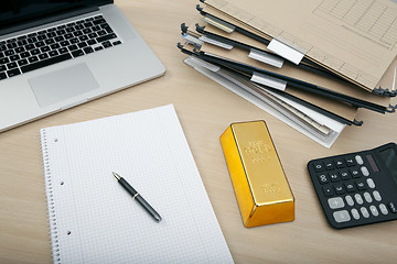 Image showing a gold bar on desk