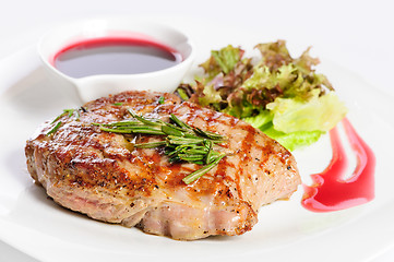 Image showing Grilled steaks and vegetable salad