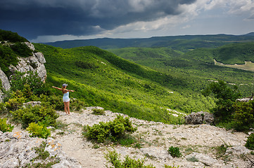 Image showing Young woman against the storm