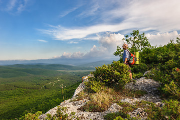 Image showing Hiking man in rays of sunset