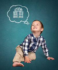 Image showing Cute boy siting on the floor