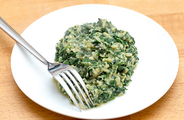 Image showing Scrambled egg with spinach and fork