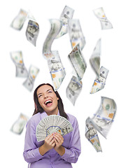 Image showing Happy Woman Holding the $100 Bills with Many Falling Around